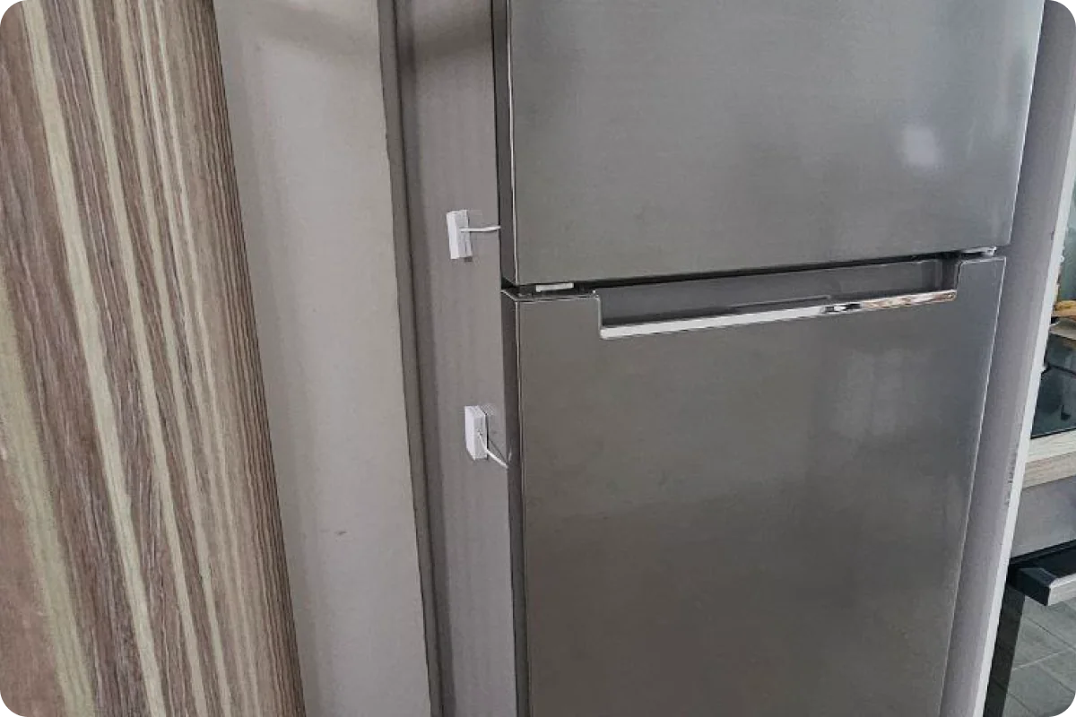 The physical sensor mounted inside the fridge and freezer